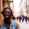 selective focus of man smiling near building